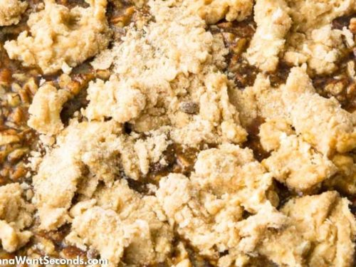 How to make Pecan Pie Cobbler, dropping the topping mixture over pecan mixture