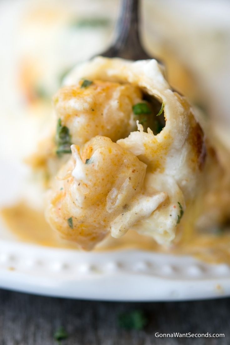 Creamy Shrimp Enchiladas, on a spoon.