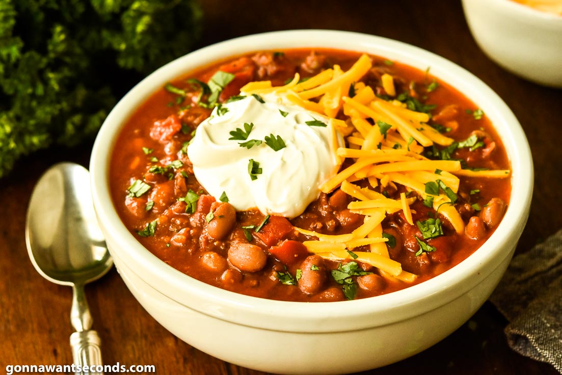 Classic Chili with a dollop of sour cream and shredded cheese on top
