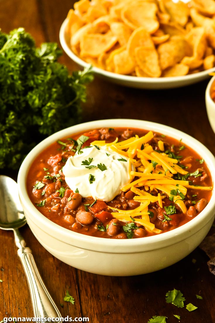 Classic Chili with a dollop of sour cream and shredded cheese on top