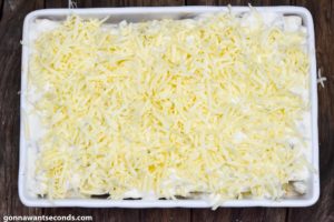 How to make Sour cream chicken enchiladas, adding sauce and cheese