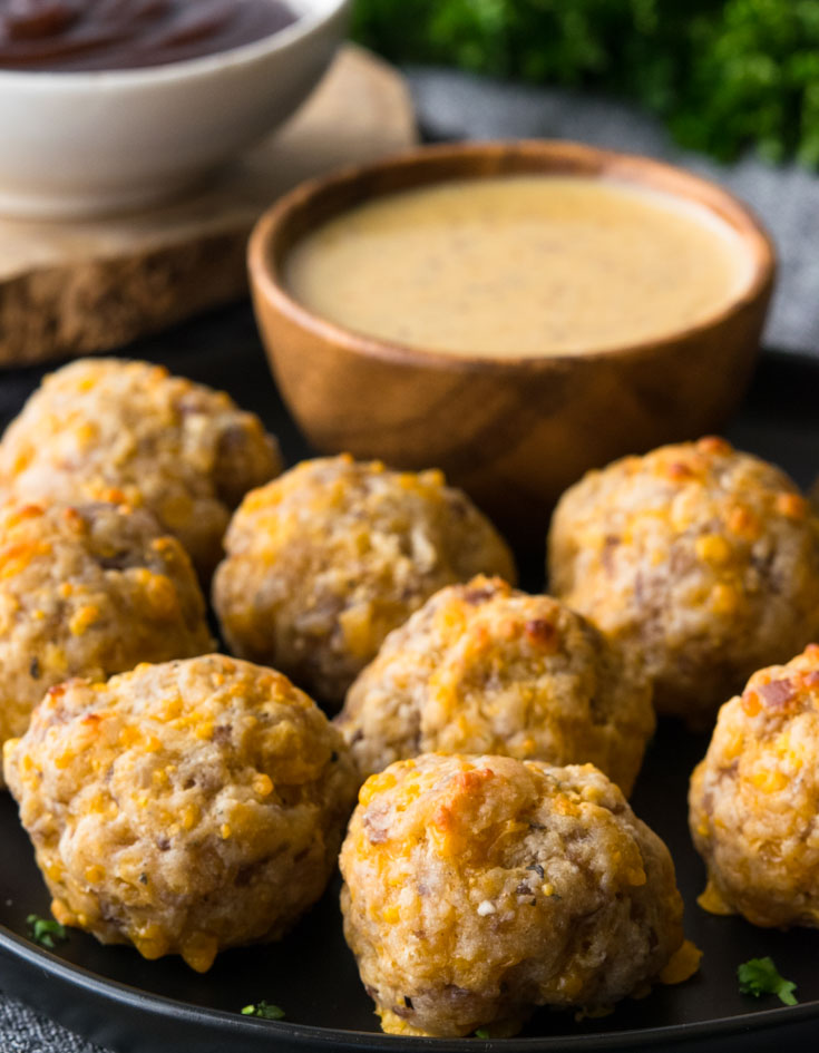 Bisquick Sausage Balls with dipping sauce on a plate