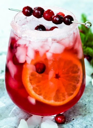 Cranberry Margarita with fresh cranberries on top