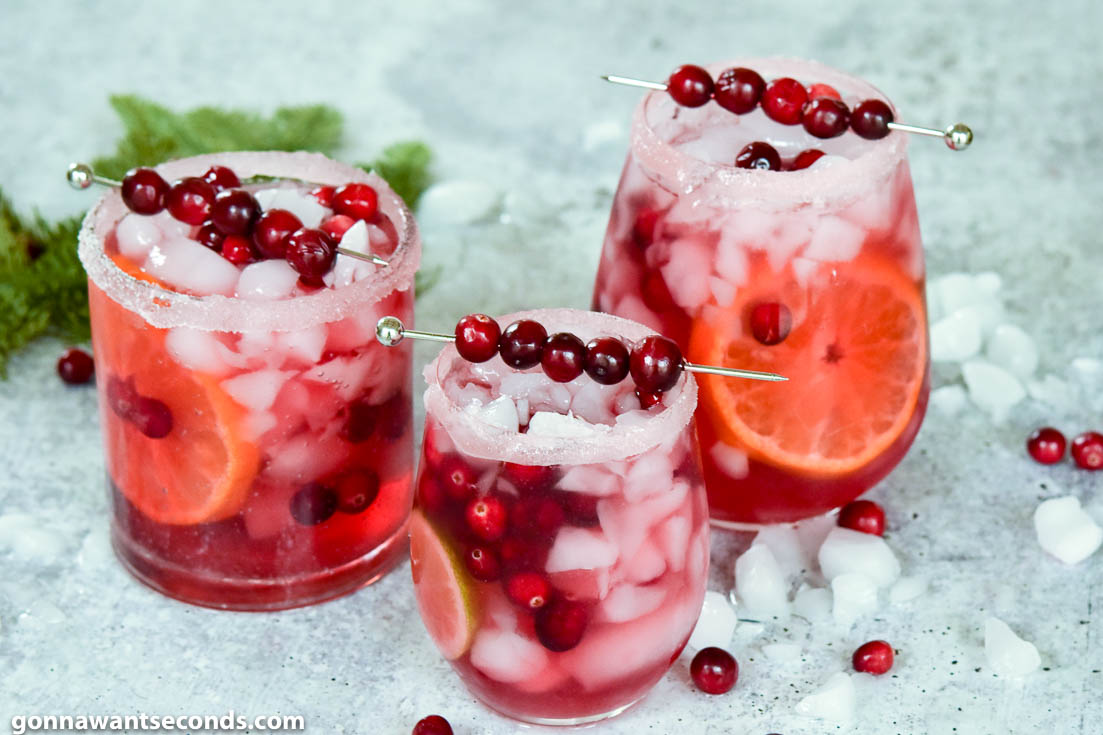 Glasses of Cranberry Margarita with fresh cranberries on top