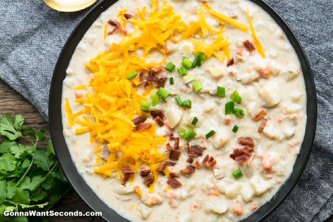 Crockpot Potato Soup topped with shredded cheese