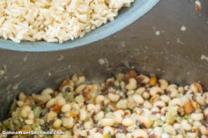 How to make Hoppin John, adding rice to pea-veggie mixture