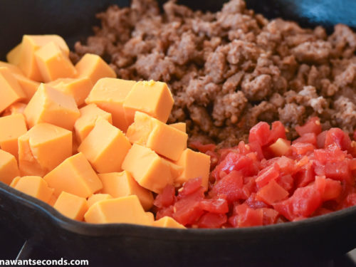 How to make Rotel Dip, mixing all ingredients in the skillet