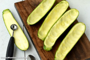 How to make Zucchini Enchilada Boats, scooping out zucchini flesh