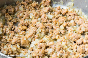 How to make Italian Stuffed Peppers, sauteing onion and beef