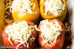 How to make Italian Stuffed Peppers, topping it with shredded cheese