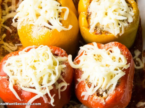 How to make Italian Stuffed Peppers, topping it with shredded cheese