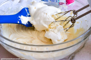 Step 6 How to make no bake blueberry yum yum, folding the whipped topping in the butter mixture