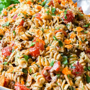 Taco pasta salad is a crowd-pleasing metropolis of taste that lends a myriad of refreshing flavors and textures to the plate.