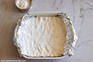 How to make Cherry Custard Pie Bars, adding crumb mixture into the prepared pan