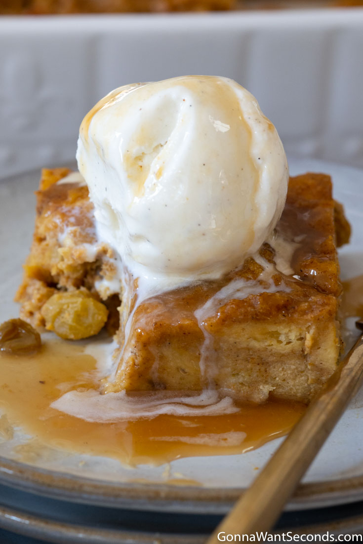 pumpkin bread pudding with caramel sauce and ice cream on top