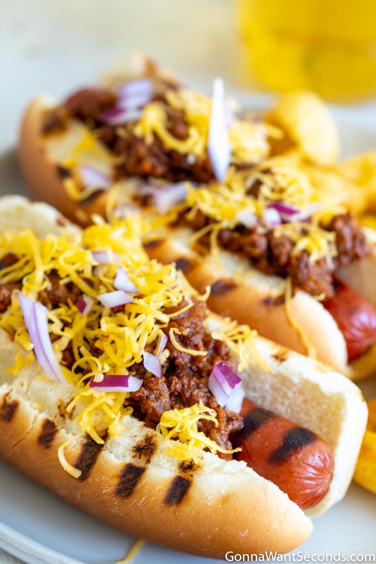 hot dog chili recipe in a bun with cheese on top