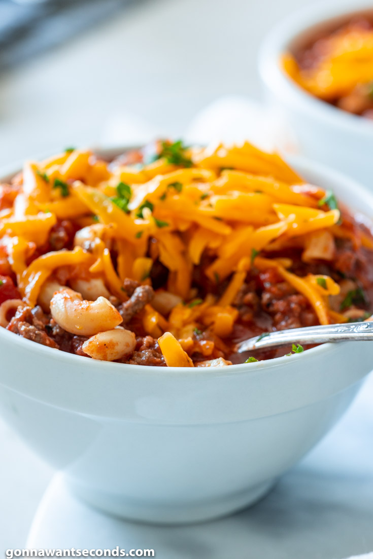 crockpot goulash with cheese on a bowl