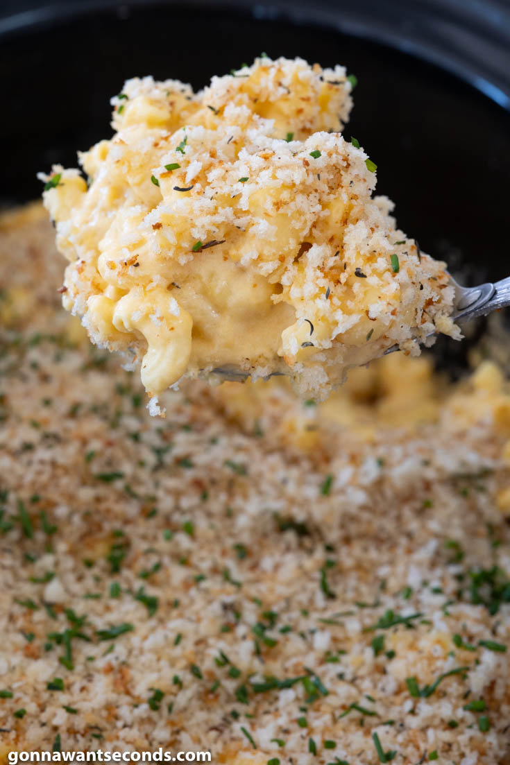Ladle scooped creamy crockpot mac and cheese