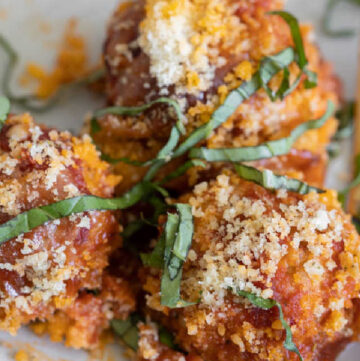 These tender and juicy chicken parmesan meatballs elevate a simple chicken dinner to something absolutely wonderful. Add this to your dinner rotation!