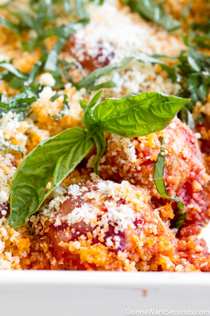 chicken parm meatballs in a casserole dish