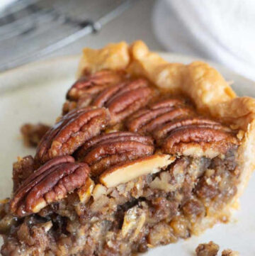 This Southern classic pecan pie features sweet rich custard & plenty of toasted pecans in a flakey golden crust that’ll put them in a yummy flavor coma.