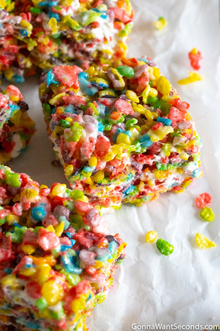 slices of fruity pebble rice crispy treats on a baking paper