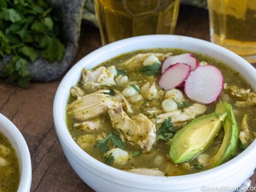 green chicken pozole, topped with sliced avocados and radishes