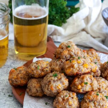 sausage balls with cream cheese on a wooden board