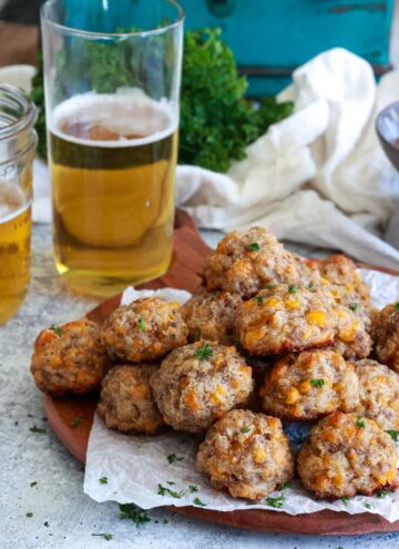 sausage balls with cream cheese on a wooden board