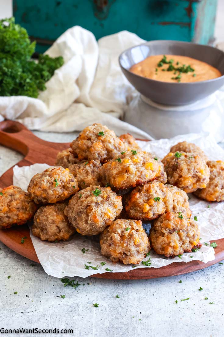 sausage balls with cream cheese with awesome sauce at the back