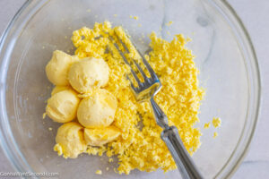 how to make southern deviled eggs step 1, mash yolk in a bowl