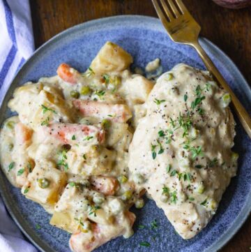 crockpot creamy ranch chicken smothered with sauce on a plate
