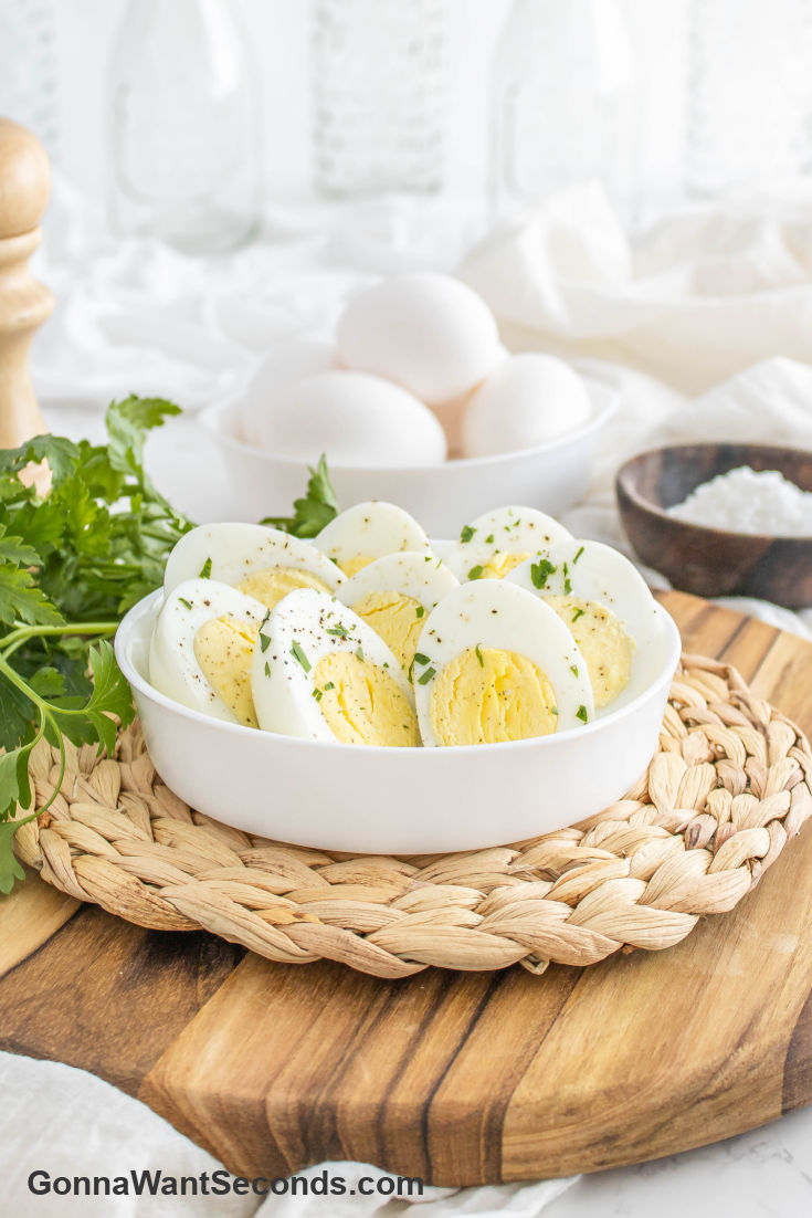 hard boiled eggs in air fryer sliced and placed in a shallow bowl