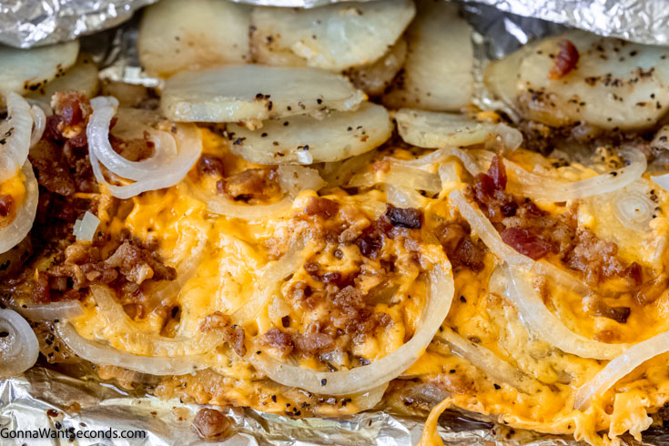 cheesy campfire potatoes, in aluminum foil