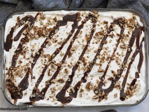How to make easy chocolate delight recipe, adding the crushed pecans and chocolate syrup