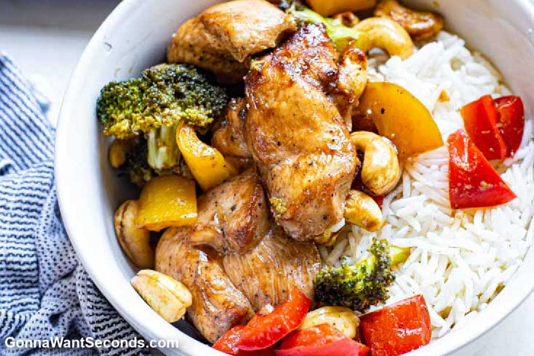 easy cashew chicken topped over a bowl of rice