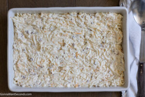 How to make crack potatoes in oven transferring the mixture in a casserole dish for baking
