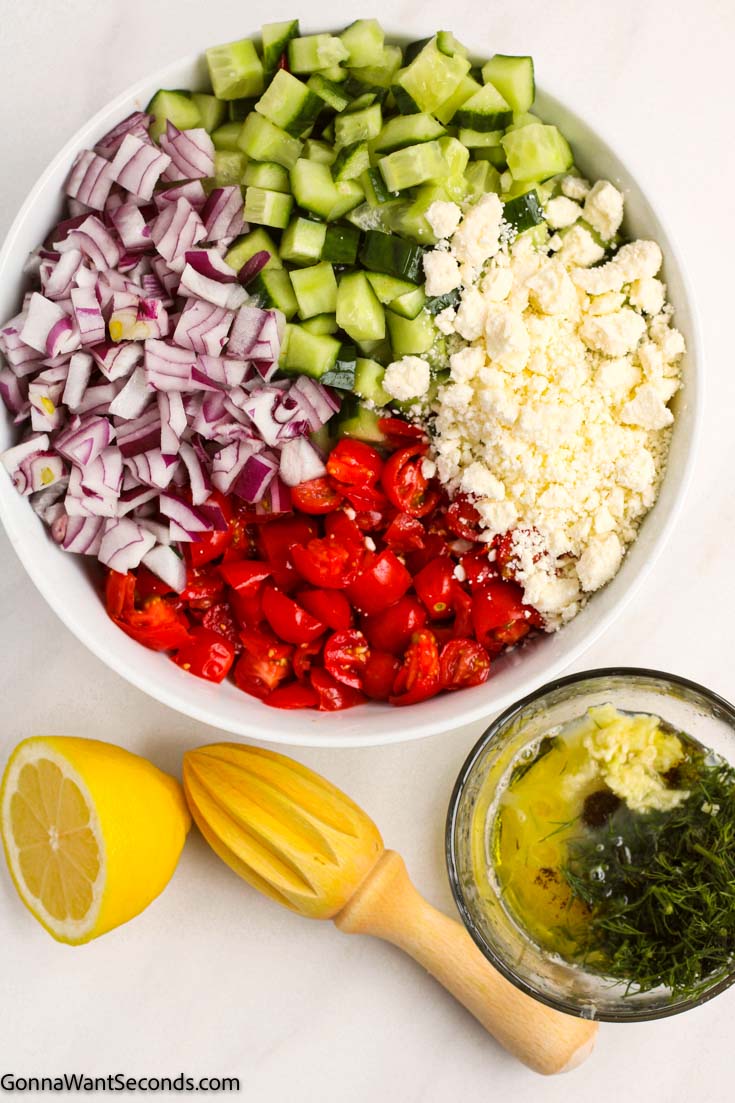 tomato cucumber feta salad with dressing on the side 