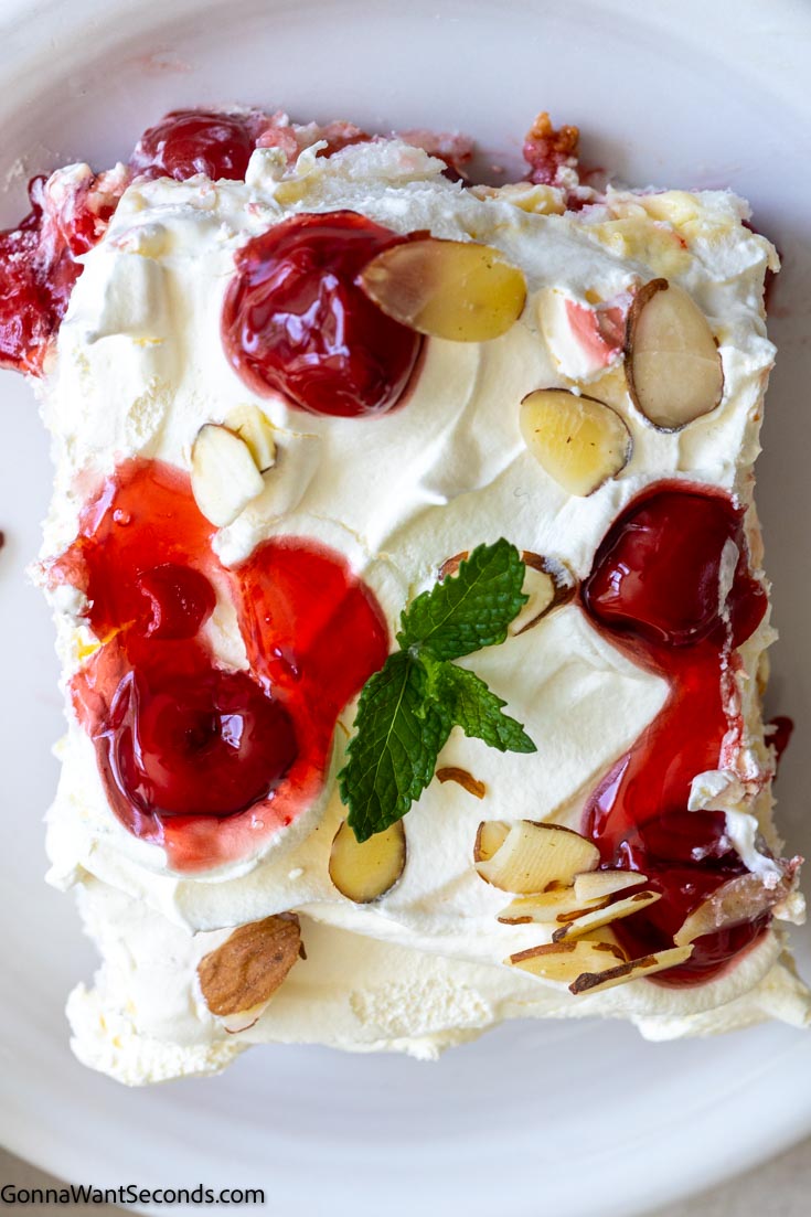 a slice of heaven on earth cake no-bake topped with cherry pie filling, top shot