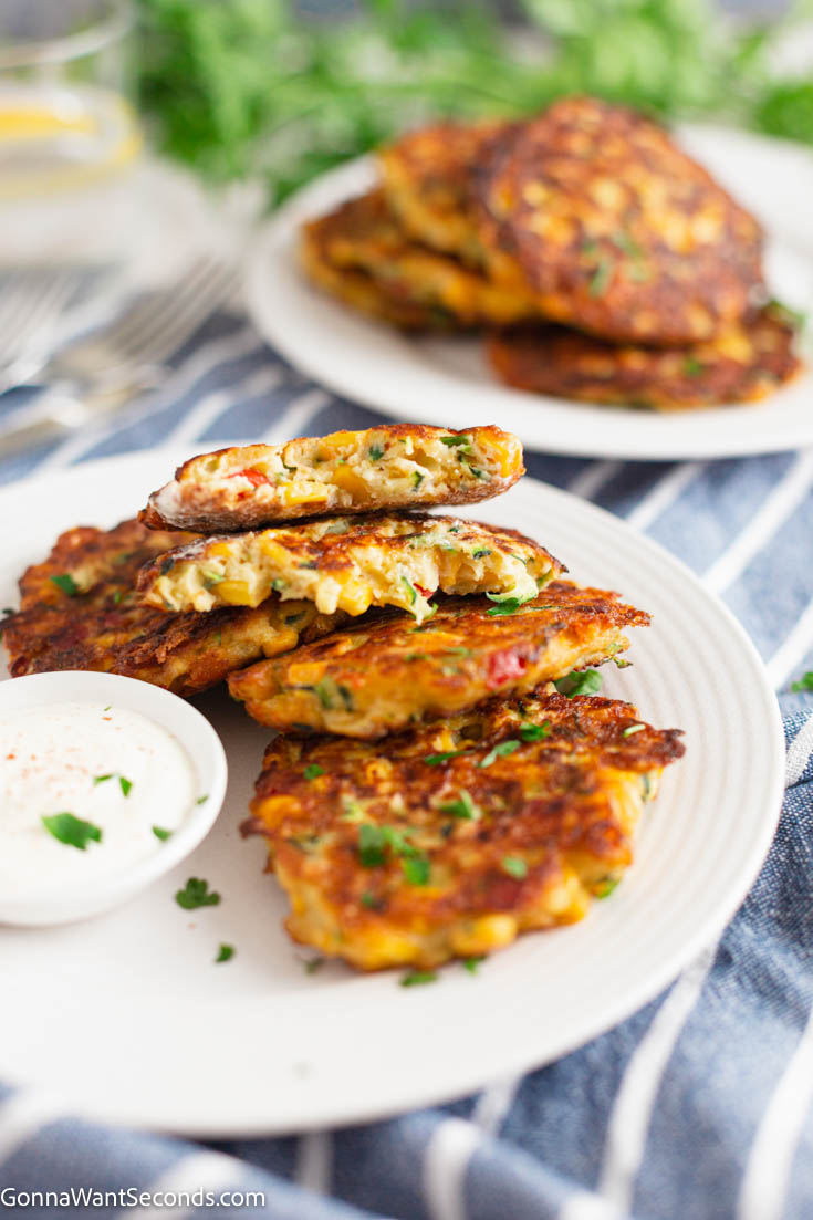 zucchini and corn fritters with dipping sauce on the side