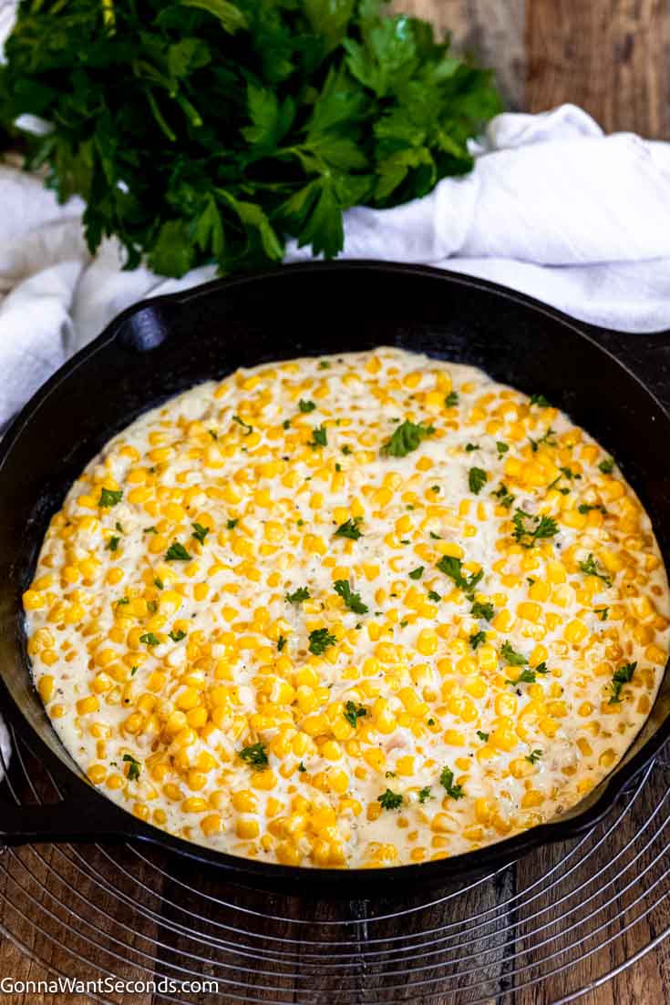 Our honey butter skillet corn is a sweet and savory side dish that's easy to make and your family will ask for on repeat!!! #buttercorn #skilletcorn honey butter skillet corn in a cast iron skillet
