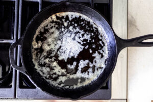 Step 1 how to make honey butter skillet corn, In a skillet, melt the butter.