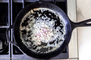 Step 2 how to make honey butter corn, Add the shallots and saute.