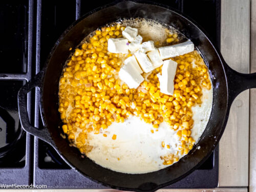 Step 4 how to make honey butter creamy skillet corn, Stir in the heavy cream and cubed cream cheese. Simmer.