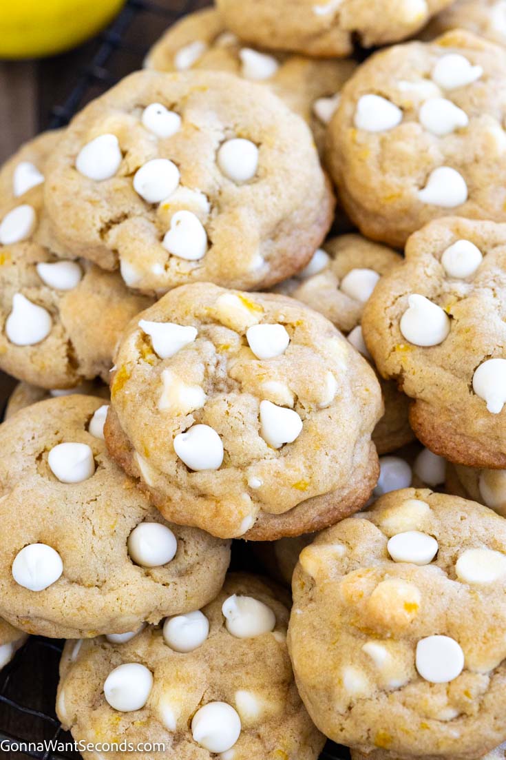 a pile of lemon chocolate chip cookies , close up