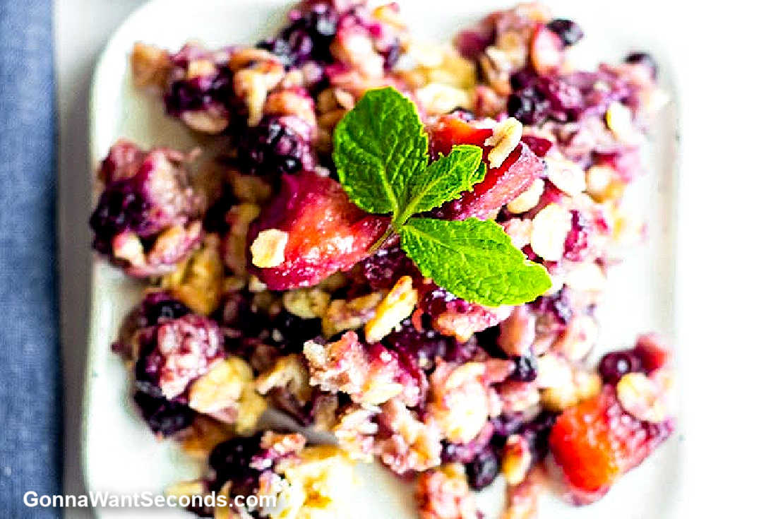 blueberry peach cobbler on a square plate
