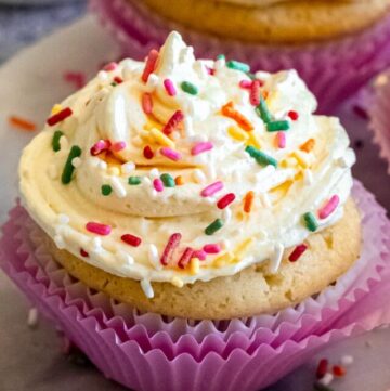 A cupcake with Cool Whip frosting with sprinkles on top