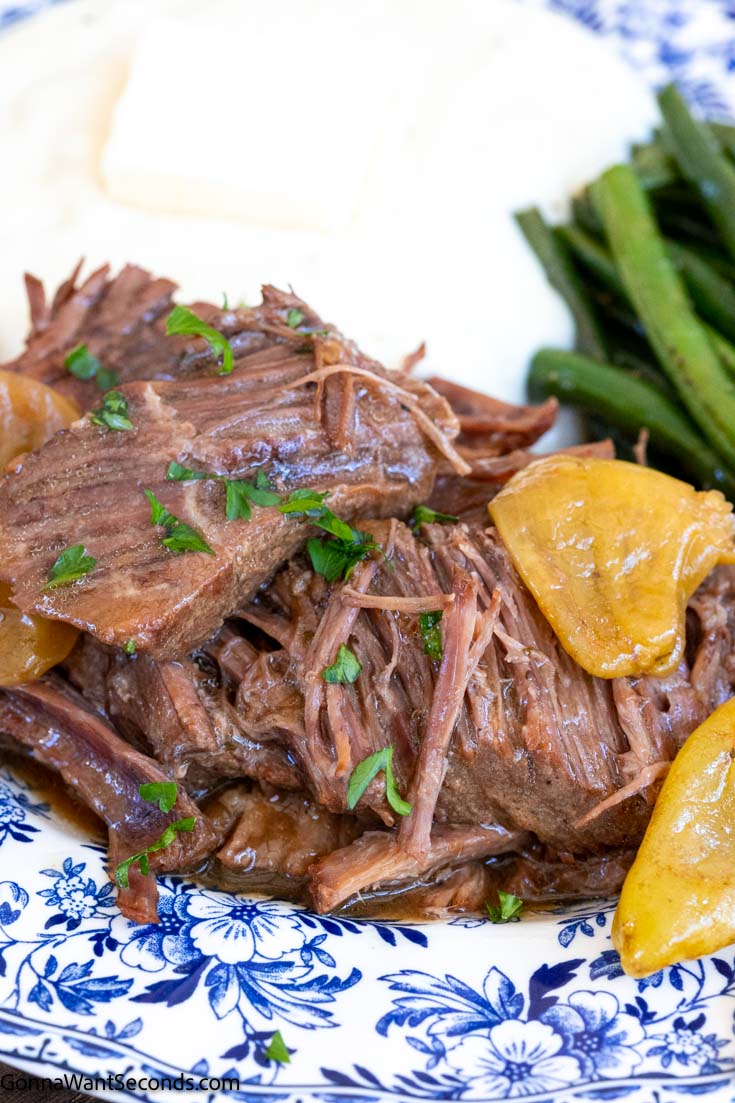instant pot mississippi roast with green beans and mashed potatoes on a plate 