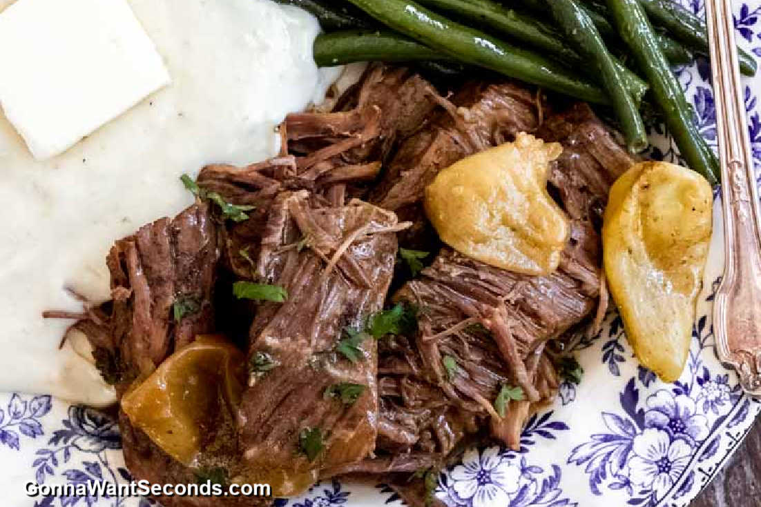 instant pot mississippi pot roast with green beans and mashed potatoes on a plate