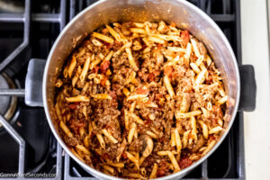 How to make Johnny Marzetti Casserole , mixing the pasta and the sauce